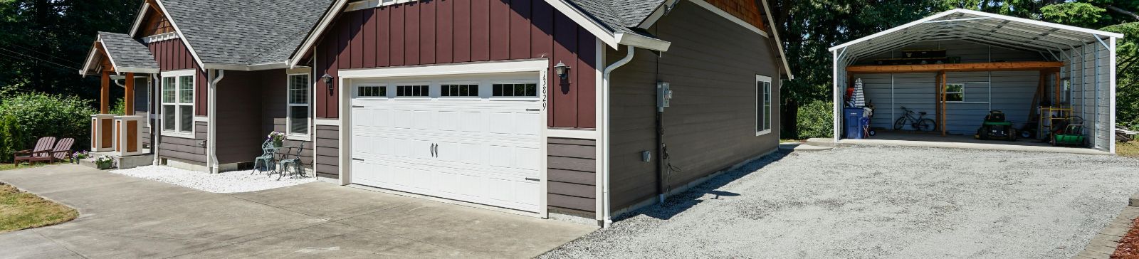 Well-maintained home and garage with white overhead door and driveway in Champlin, MN[1]