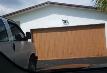 Exterior view of old sectional garage door in Ramsey, MN home.