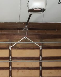 Interior view of electric garage door with opener and safety features in Ramsey, MN.
