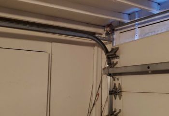 Bent garage door track repair and replacement in Osseo, MN