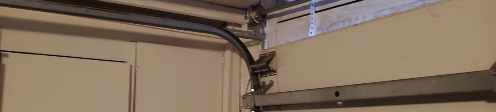 Bent garage door track repair and replacement in Osseo, MN
